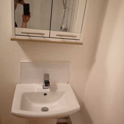 Monobloc basin tap