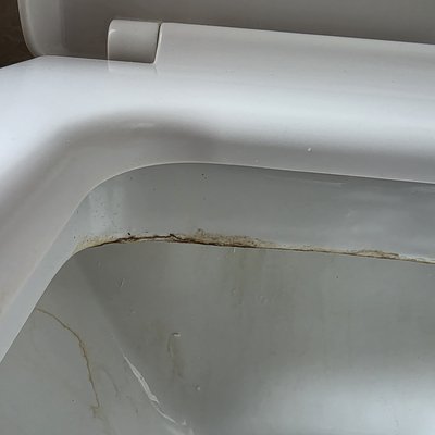 Staining from toilet flush valve letting by