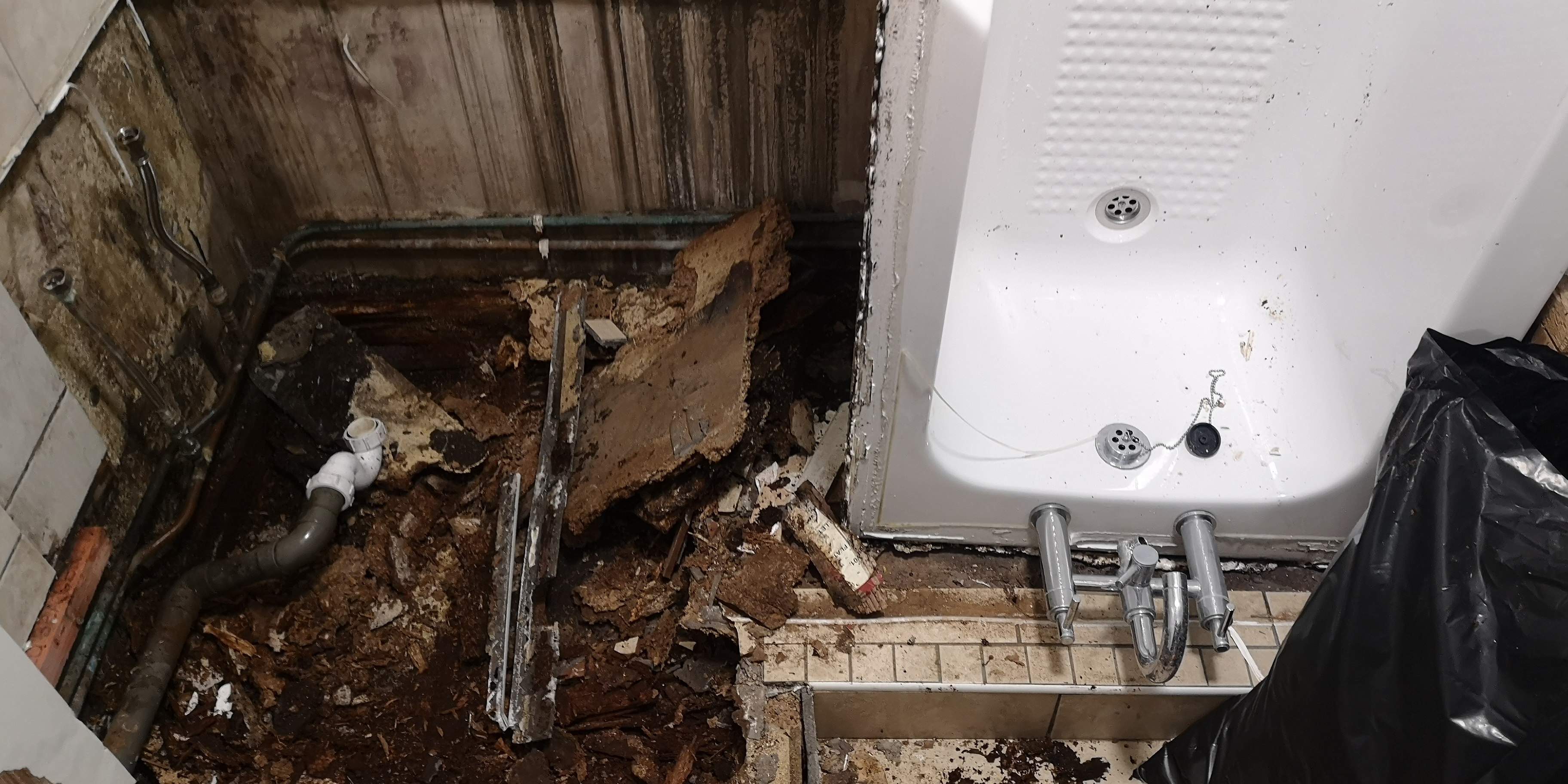 Water damage under a bath