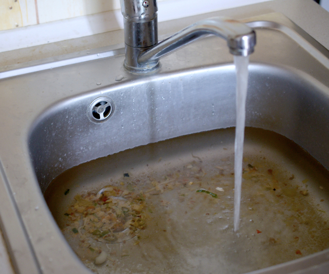 Blocked sink with standing water