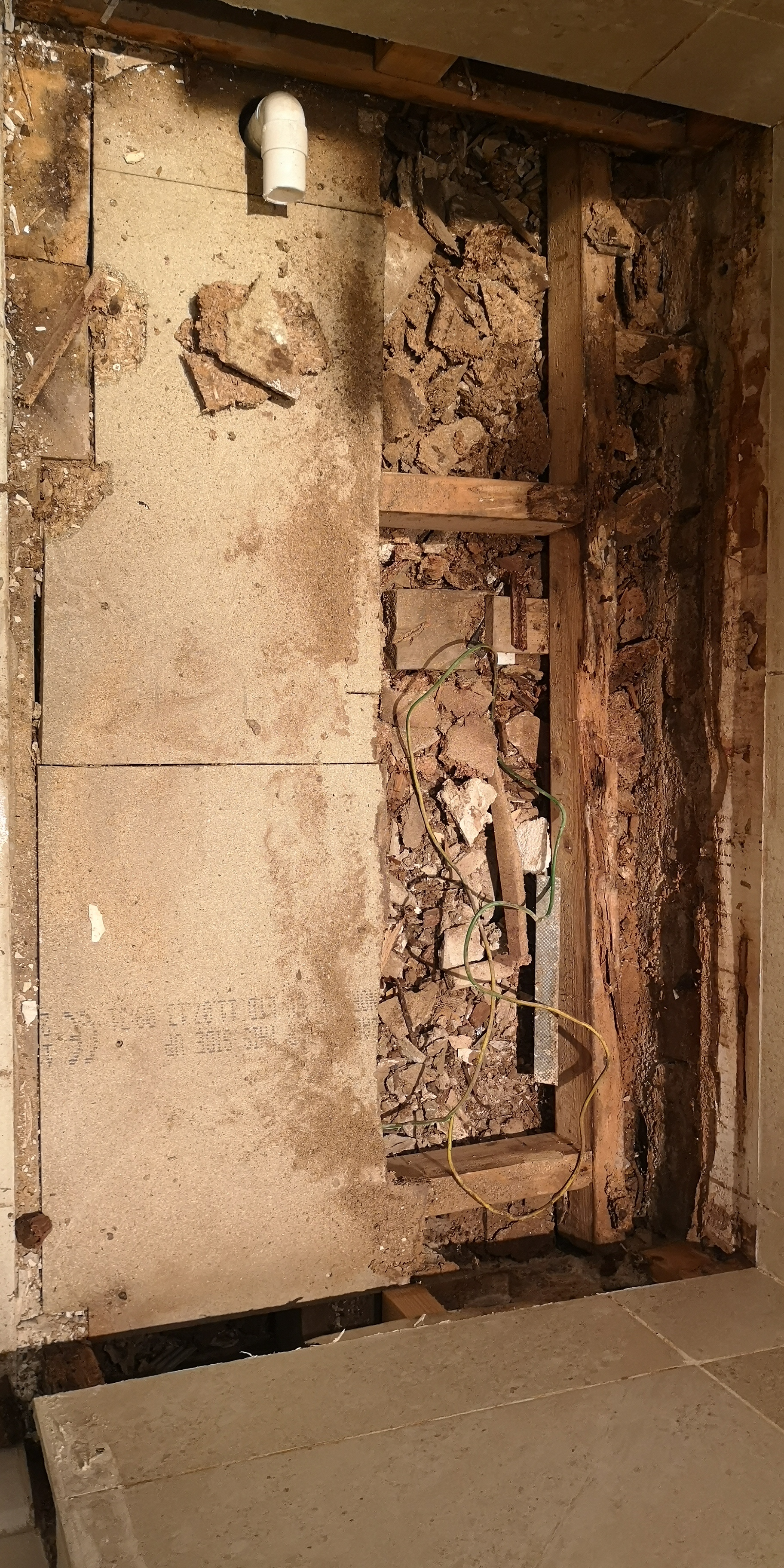 Water damage from a shower tray leak