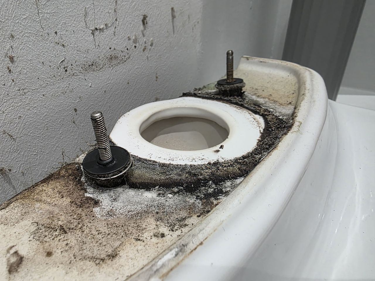 Toilet cistern bolts fitted upside down during poor installation