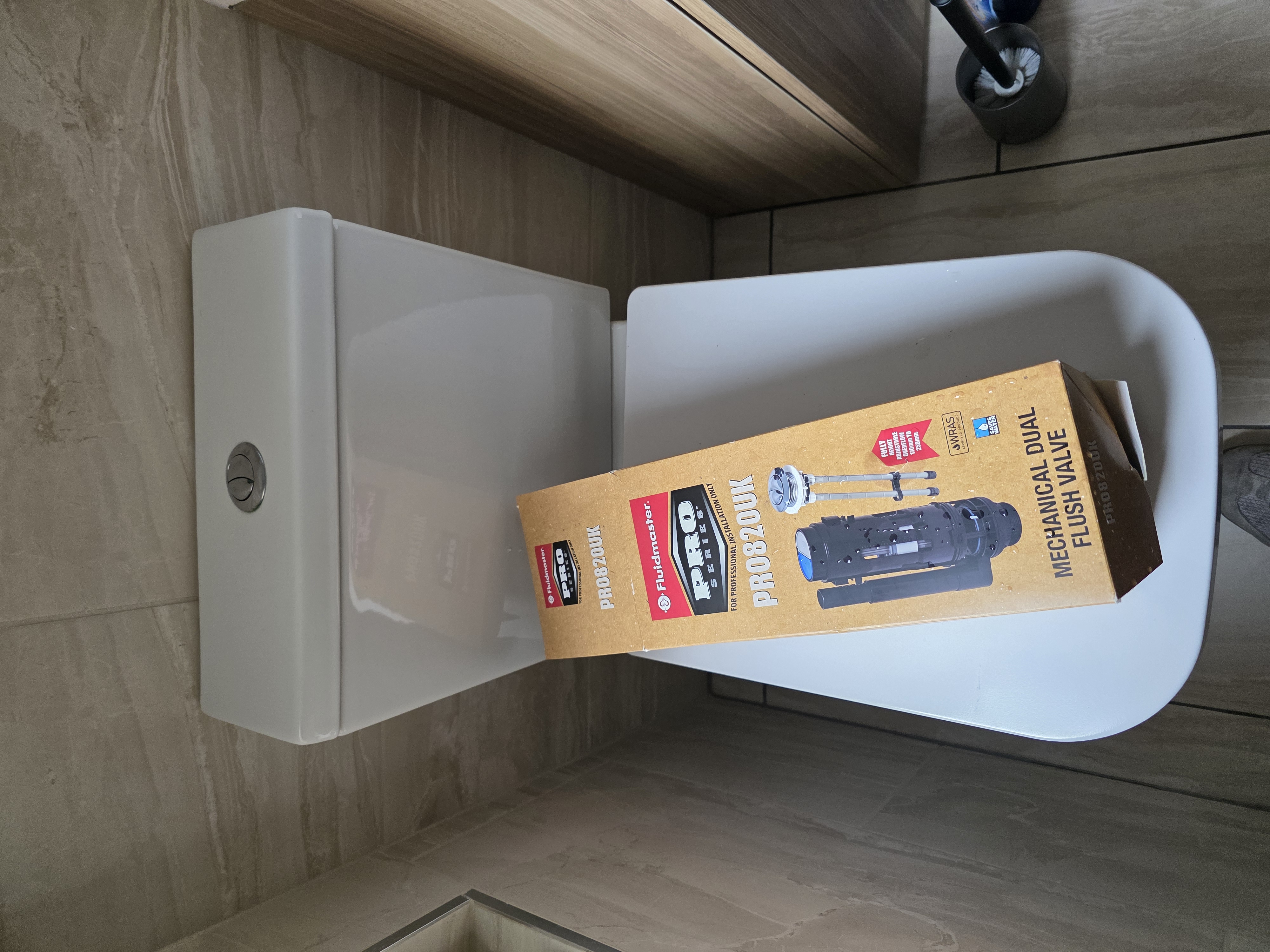 Toilet with modern Fluidmaster flush valve installed